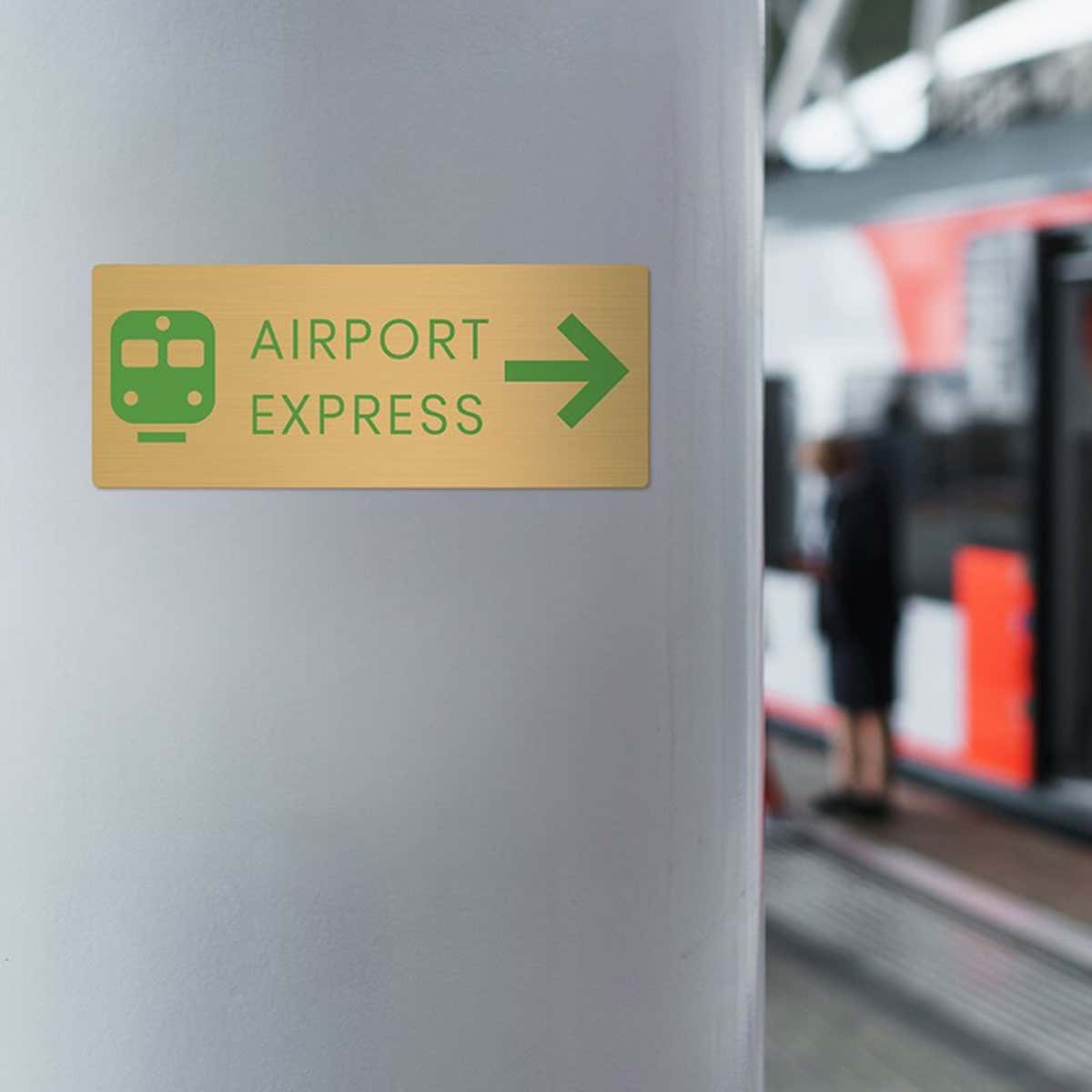 4x10 printed brass sign displayed by a train station