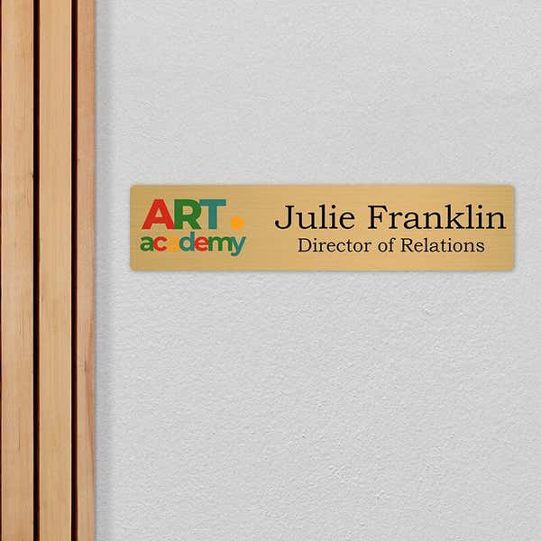 4x18 printed brass sign displayed by a doorway