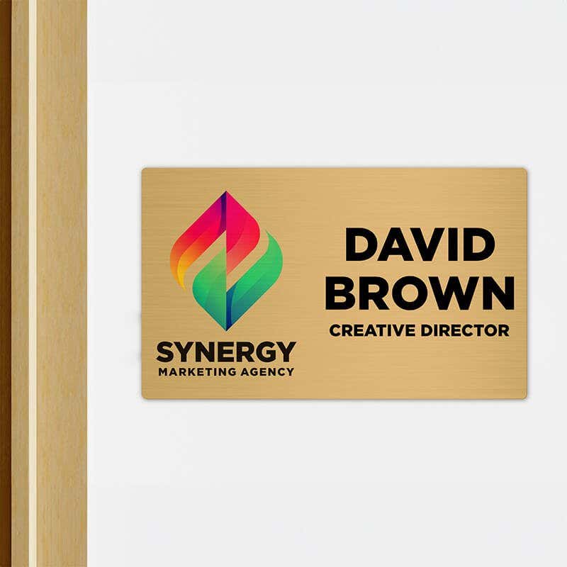 6x10 printed brass sign displayed outside of an office