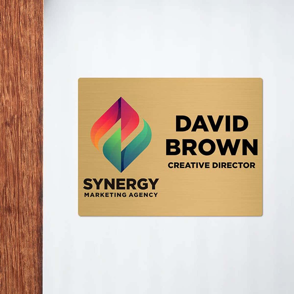 6x8 printed brass sign displayed next to a doorway