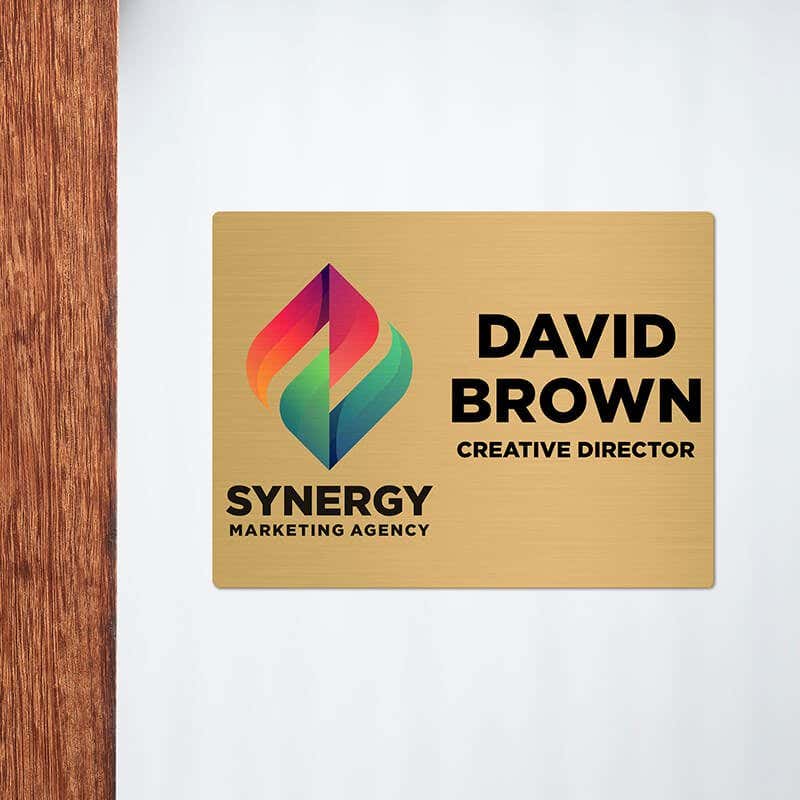 6x8 printed brass sign displayed next to a doorway
