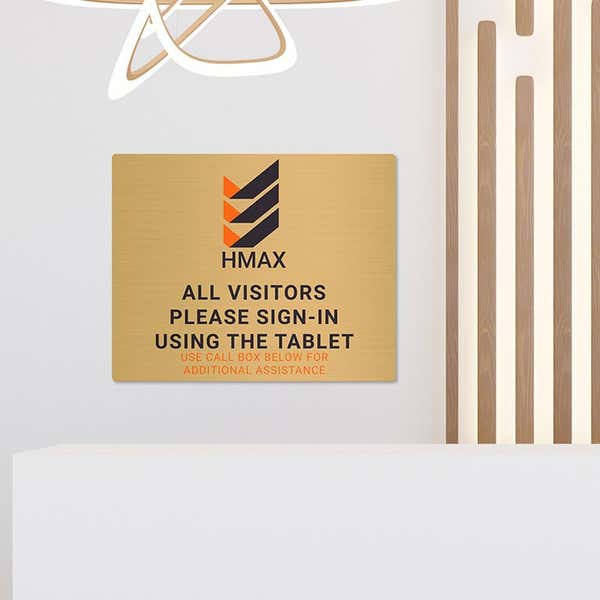 8x10 printed brass sign displayed in a waiting room