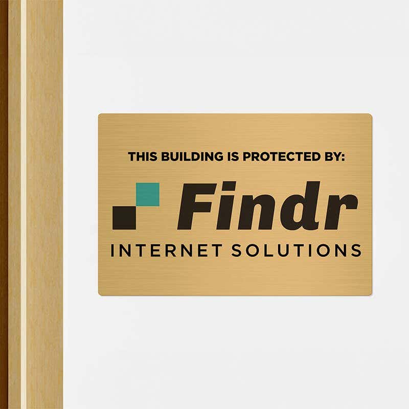 8x12 printed brass sign displayed by a doorway