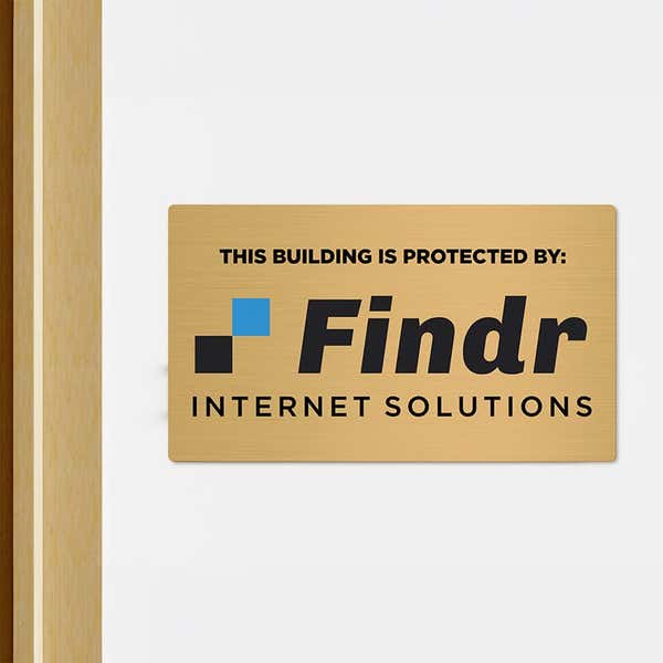8x14 printed brass sign displayed in a doorway
