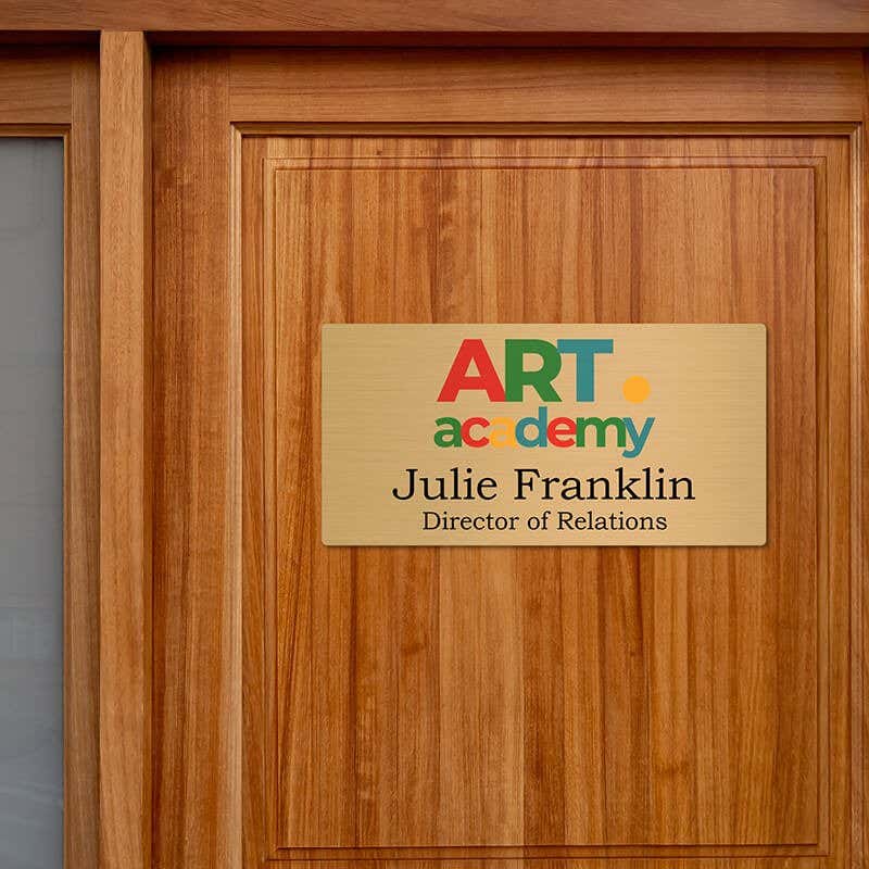 8x16 printed brass sign displayed on a door
