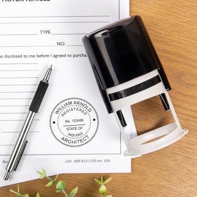 The State of Indiana Architect Stamp impression next to the self-inking stamp and a pen