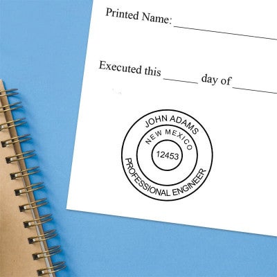The State of New Mexico Engineer Seal impression at the bottom of a document with a blue background