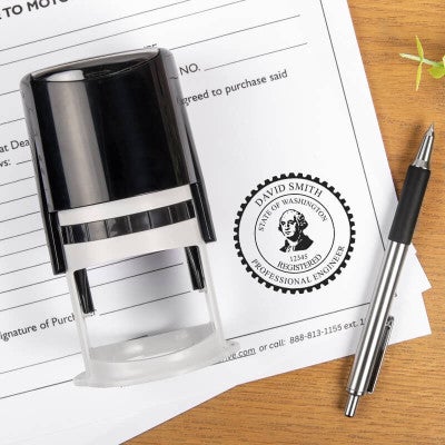 The State of Washington Engineer Seal on the bottom of a document next to a pen and self-inking stamp
