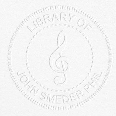 Treble Clef Music Symbol Embosser impression on grey paper