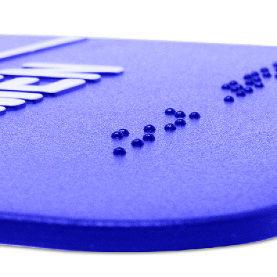 Close up of the braille on the ADA restroom sign