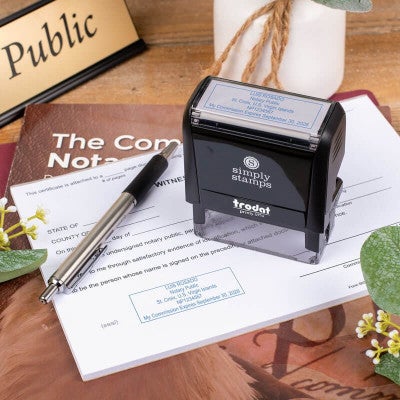 U.S. Virgin Islands Notary Stamp Impression on a Document Next to the Stamp Body and a Pen