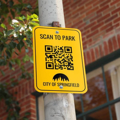 An Aluminum Sign to Scan to Park with a QR Code