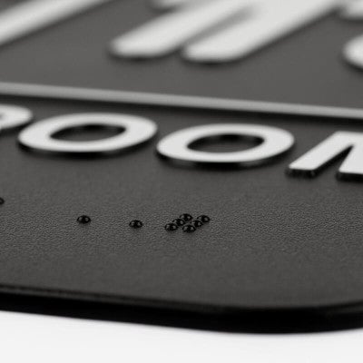 Close up of the Braille on the sign