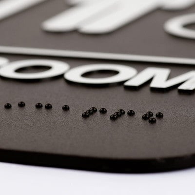Close up of the Braille on the sign