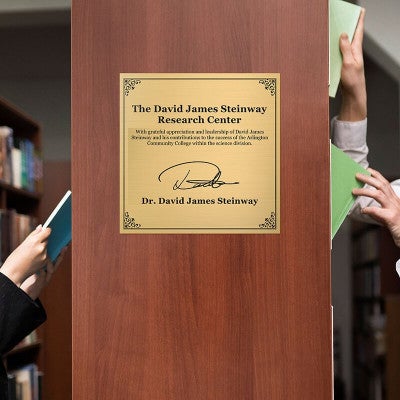 10x10 custom engraved sign displayed on a bookshelf