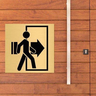 4x4 custom engraved brass sign displayed on a wall