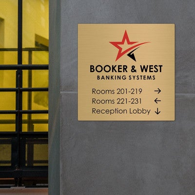 Custom printed brass sign displayed on a wall