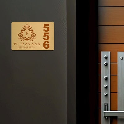 2x3 printed brass sign displayed next to a doorway