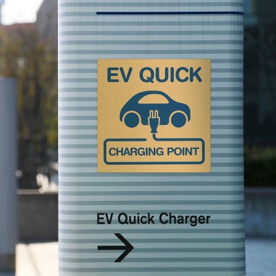 Custom printed brass sign for a charge point