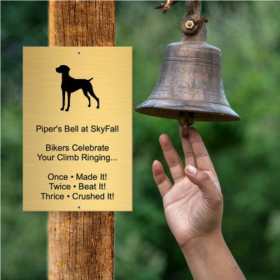 Custom Engraved Brass Sign Next to a Bell for Ringing After Completing a Bike Trail