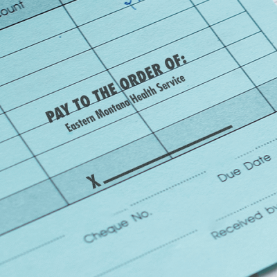 Pay to the Order of with Signature Space Financial Stamp in Use