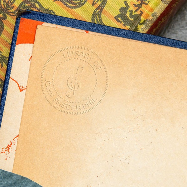 Example of Treble Clef Music Symbol Custom Book Embosser impression in book