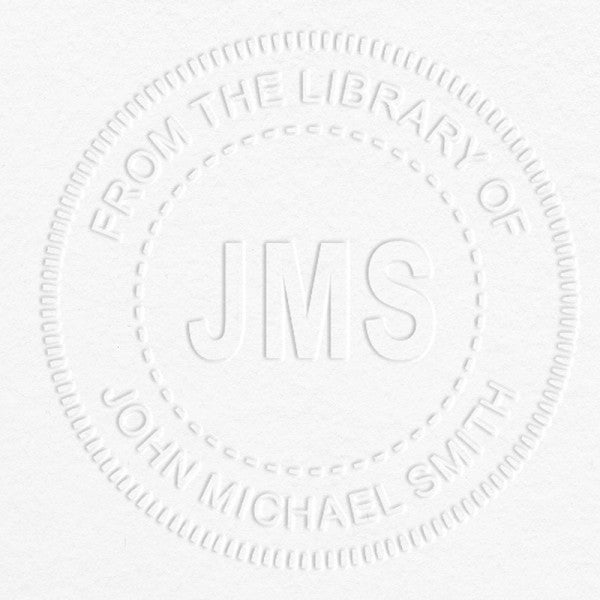 Example of From the Library Initials Personalized Book Embosser Imprint on grey paper
