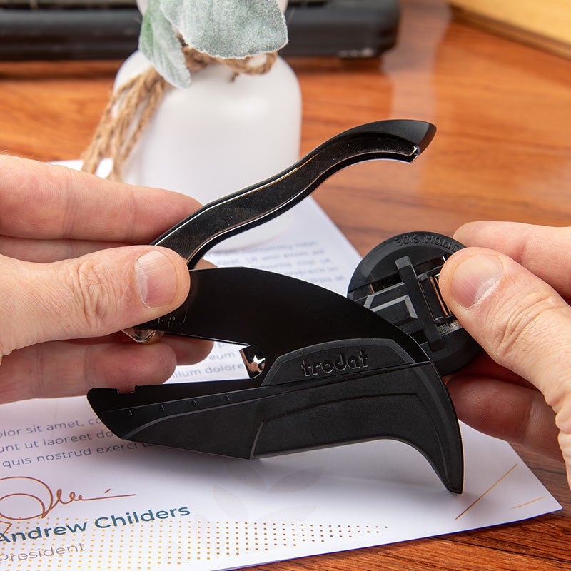 The embosser insert tucks away for tidy keeping.