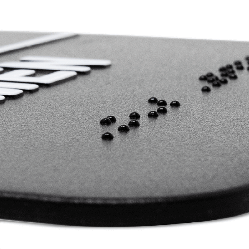 Close up of the braille on the sign