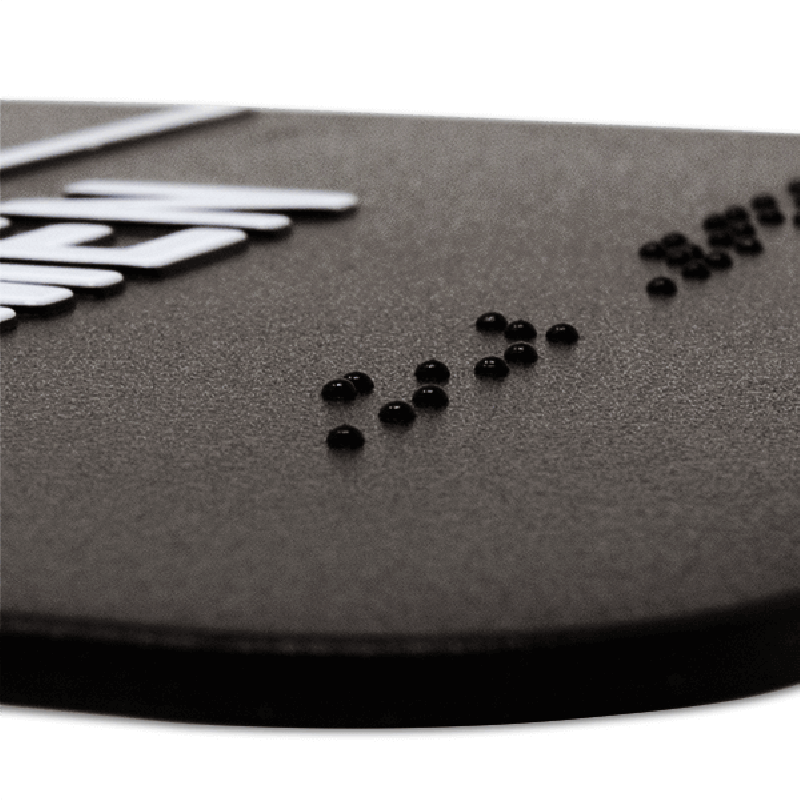 Close up of the Braille on the ADA sign