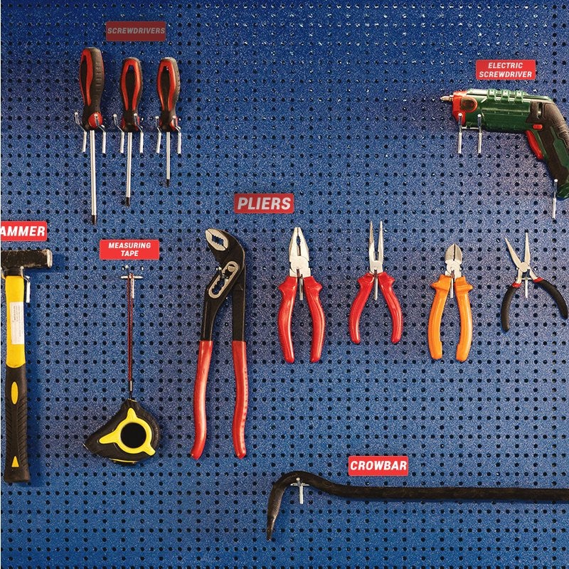 Small engraved plastic signs used to label tools