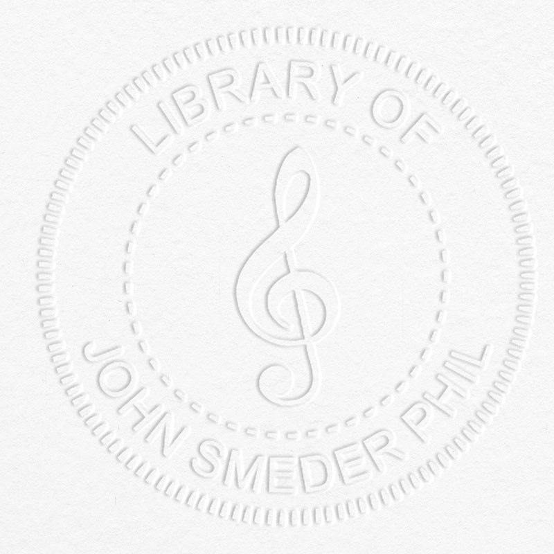 Treble Clef Music Symbol Embosser impression on grey paper