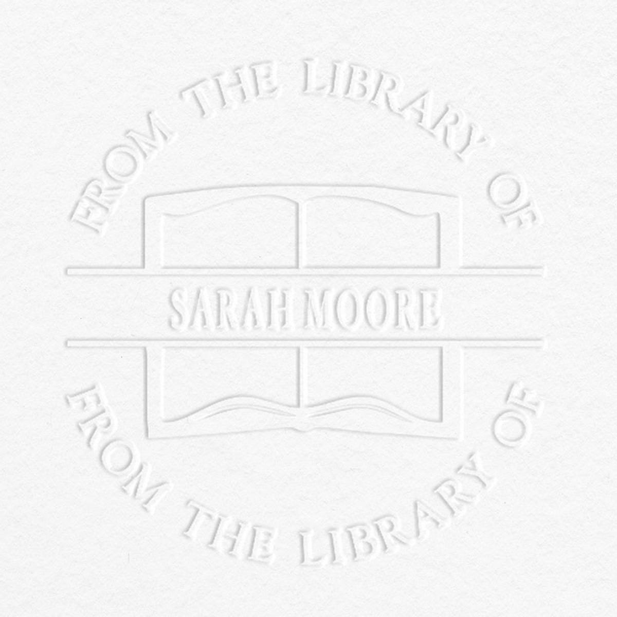 Example of From the Library Book Name Embosser Impression on Grey Background