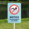 An Aluminum Sign Notice for a No Swimming Area