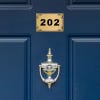2x3 custom engraved brass sign displayed on a door