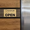 6x10 custom engraved brass sign displayed on a wall