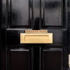 1x8 printed brass sign displayed on a door
