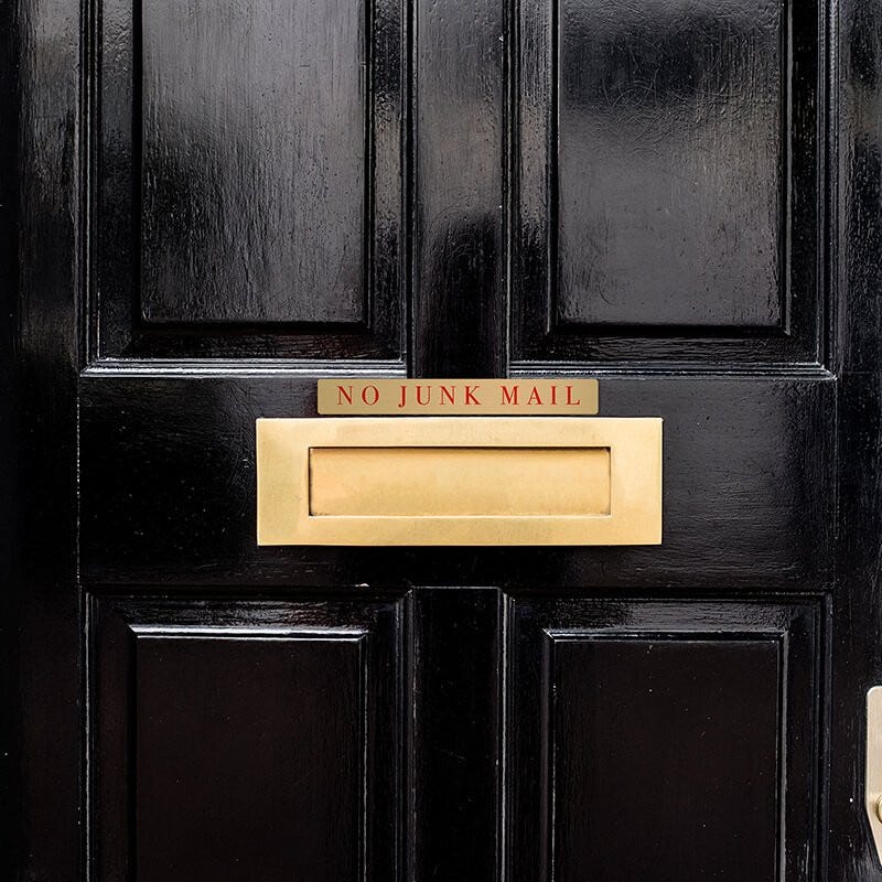 1x8 printed brass sign displayed on a door