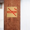 3x3 printed brass sign displayed on a wall