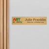 4x18 printed brass sign displayed by a doorway