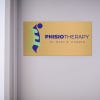6x12 printed brass sign displayed by a doorway