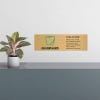 6x20 printed brass sign displayed by a front desk