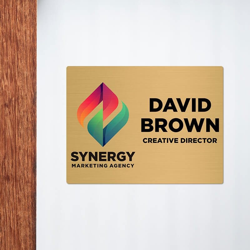 6x8 printed brass sign displayed next to a doorway
