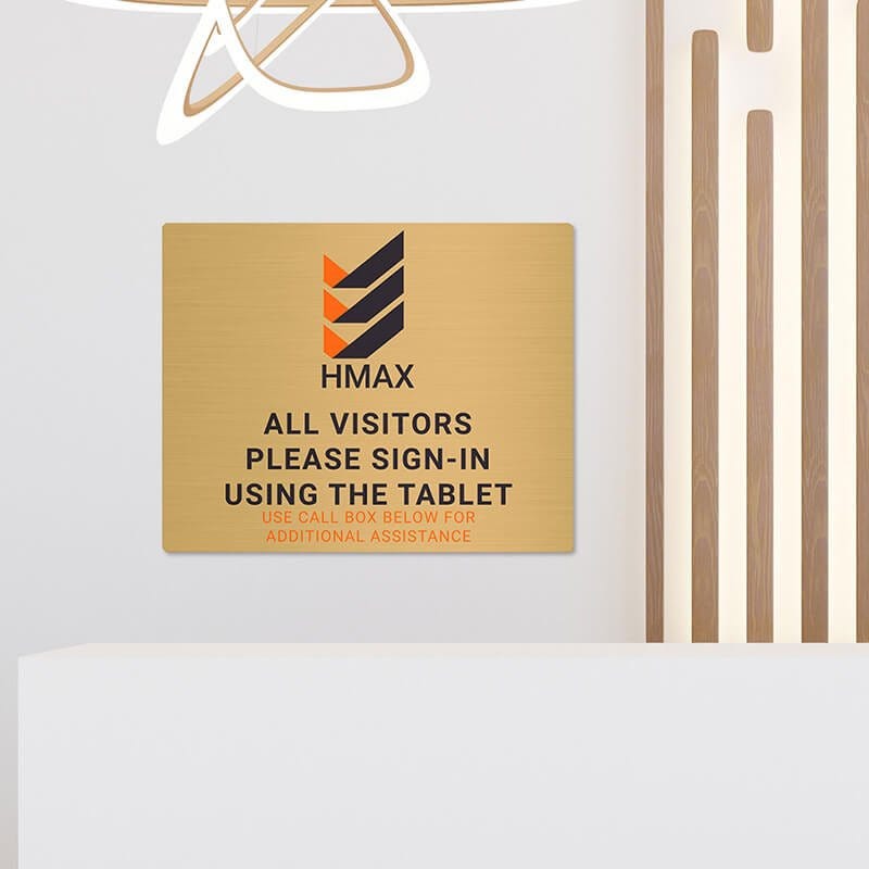 8x10 printed brass sign displayed in a waiting room
