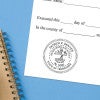 The State of Tennessee Architect Seal impression at the bottom of a document with a blue background
