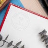 Example of personalized book embosser impression on book