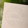 This is what the raised impression left by the LLC Seal Embosser looks like on paper.