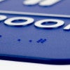 Close up of the Braille on the sign