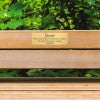 2x6 custom engraved brass sign displayed on a bench