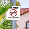 Private property No soliciting sign hung on a metal post reading, "No excuses, no exceptions"